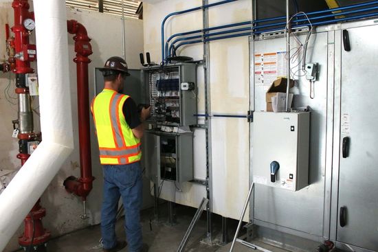 Electrician Working On Electrical Wirings — Killeen, TX — CWS Services
