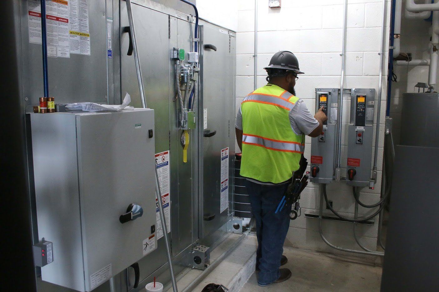 Electrician Working On Water Heater — Killeen, TX — CWS Services Electrician Working On Water Heater — Killeen, TX — CWS Services