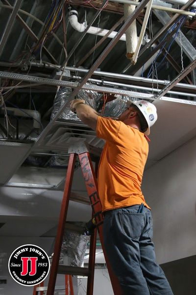 Electrician Working On Air Conditioner — Killeen, TX — CWS Services Electrician Working On Air Conditioner — Killeen, TX — CWS Services