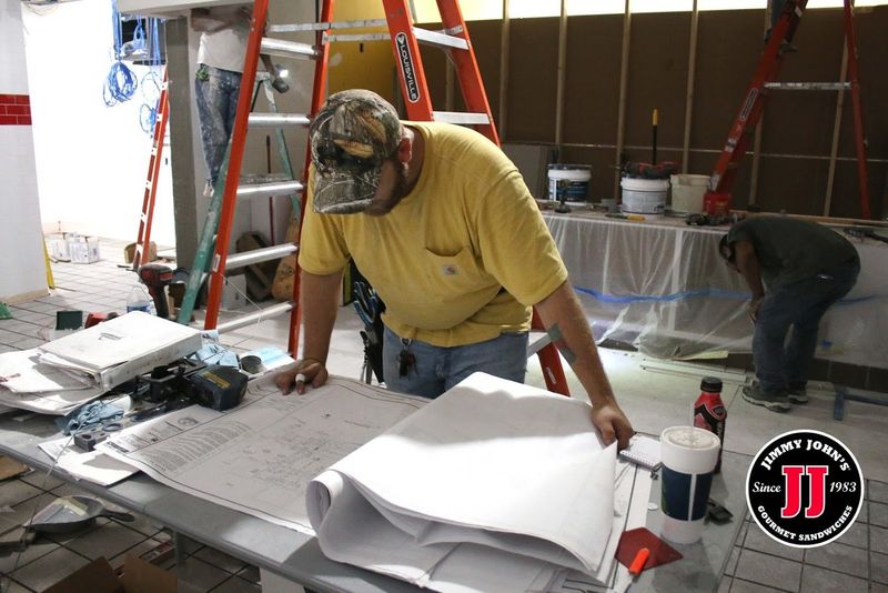 Man Looking At A Blueprint — Killeen, TX — CWS Services Man Looking At A Blueprint — Killeen, TX — CWS Services