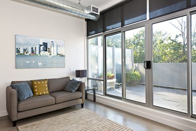 Sliding Door — Room With A Sofa And An Interior Window in Davie, FL Sliding Door — Room With A Sofa And An Interior Window in Davie, FL