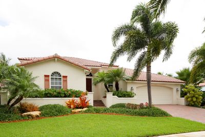 Glass Repair — White House With A Tree And Grass Outside in Davie, FL Glass Repair — White House With A Tree And Grass Outside in Davie, FL