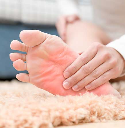 Foot Doctor Jackson MI — Holding Foot in Jackson, MI Foot Doctor Jackson MI — Holding Foot in Jackson, MI
