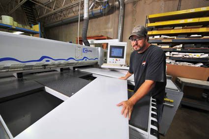 A worker providing acrylic sheets near Brooklyn Park