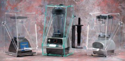 Three blenders each enclosed in a clear plastic sound enclosure.