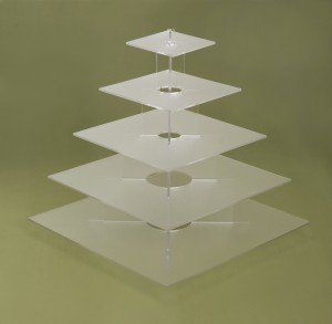 Clear, tiered square cake stand with suspended platforms.
