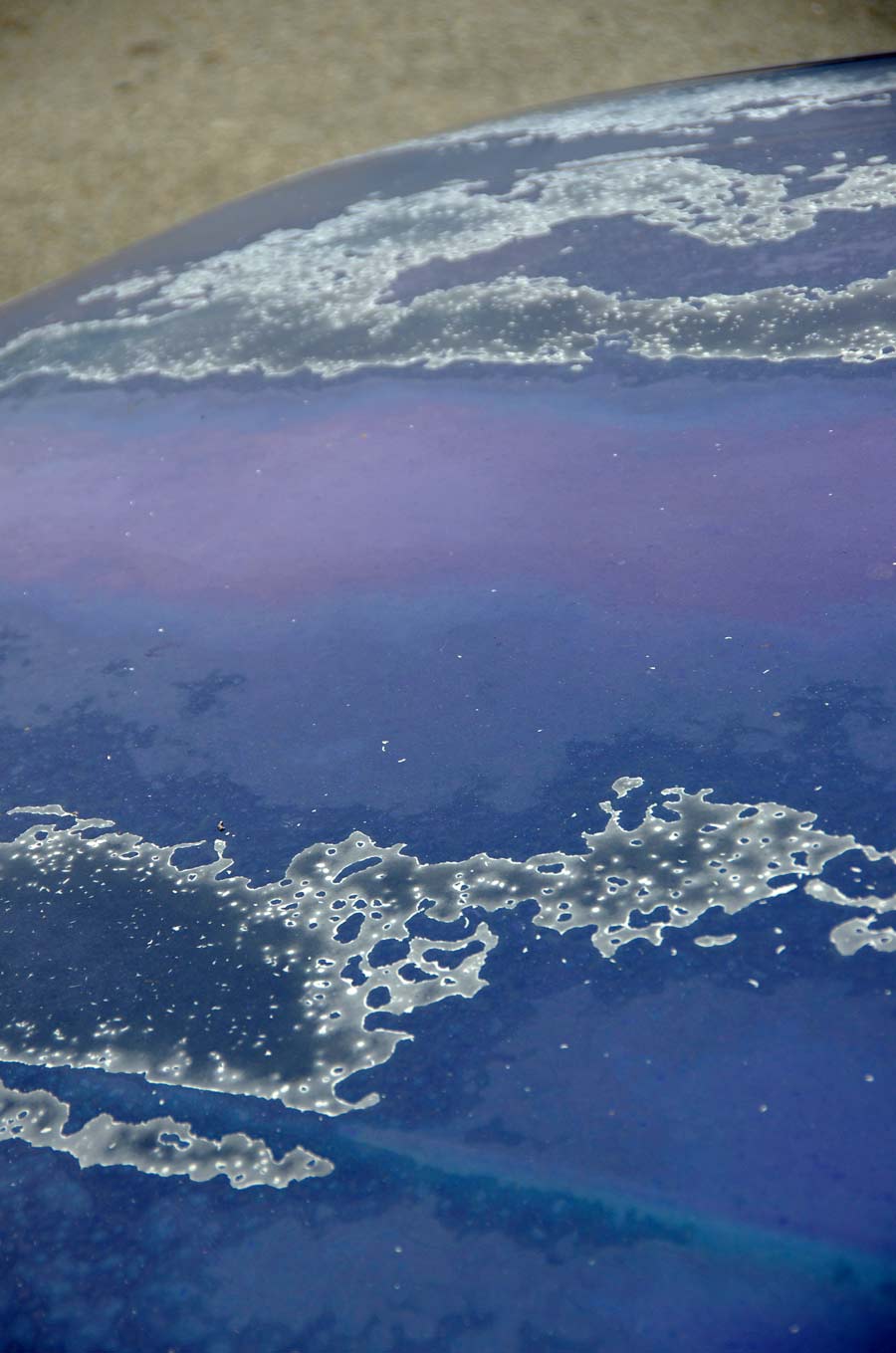 blue car with paint damage