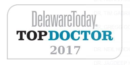 Delaware Today Top Doctor 2017 award logo in a gray rounded rectangle. The words 