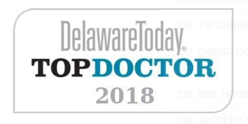 Delaware Today Top Doctor 2018 logo in a white and gray rounded rectangle.