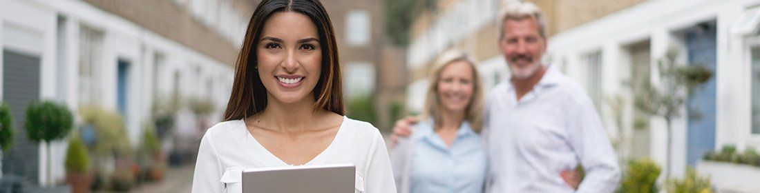 women helping couple invest in property