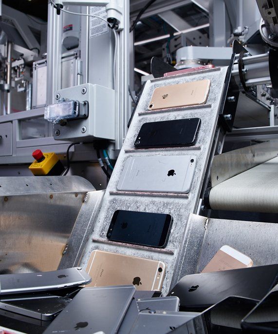 A conveyor belt carrying apple iphones and ipads