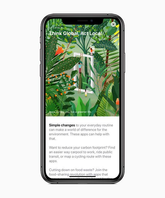 A cell phone with a picture of a jungle on the screen.
