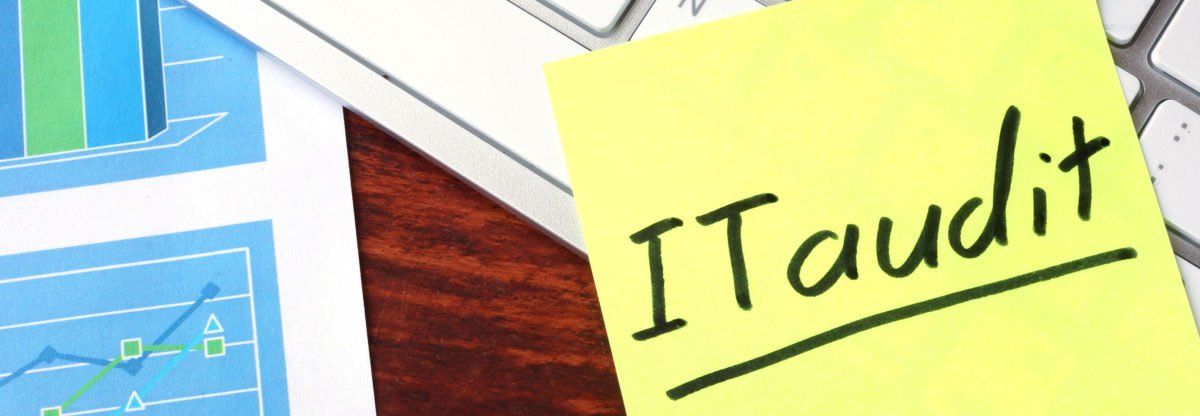 A yellow sticky note with the words `` it audit '' written on it.