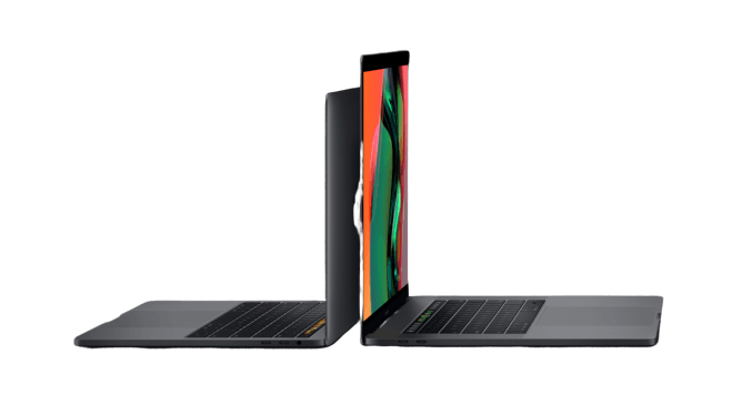 Two dark gray laptops placed back-to-back, one showing a colorful abstract screen display.