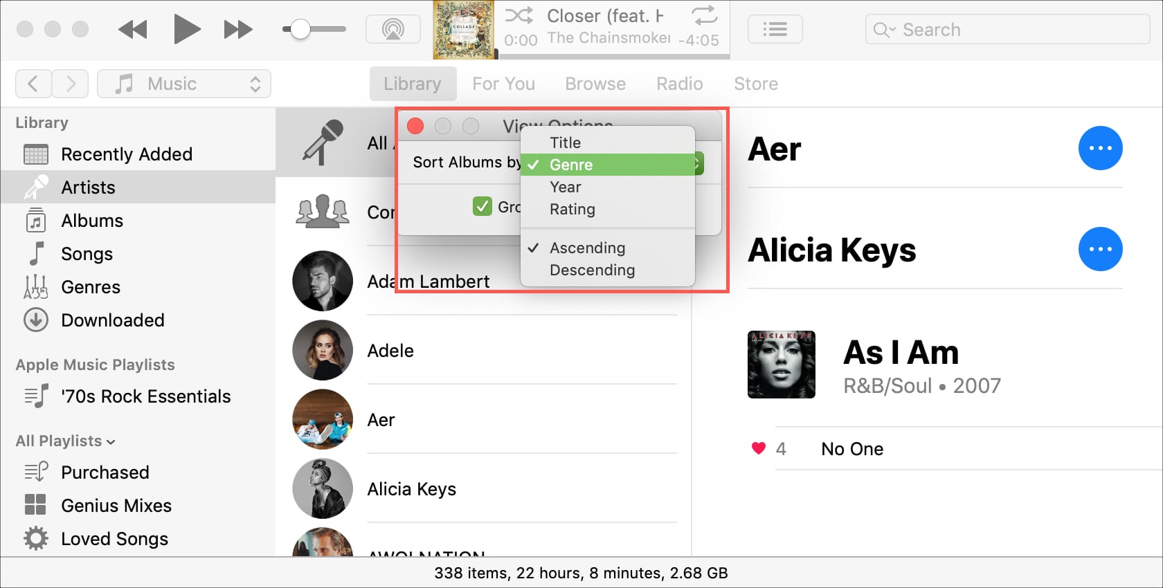 A computer screen shows a list of songs including alicia keys
