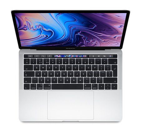 A macbook pro is open and sitting on a white surface.