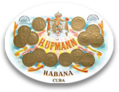 Un piatto bianco con delle monete sopra che dice hupmann habana cuba