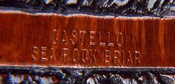 Un primo piano di un pezzo di legno con la scritta Castello Sea Rock Briar