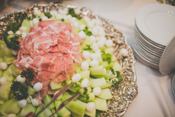A plate of food with meat and vegetables on a table.