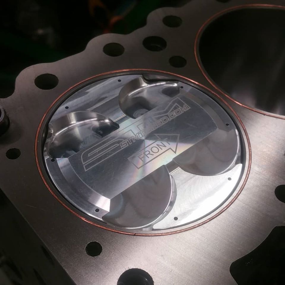 A close up of a piston that says iron on it