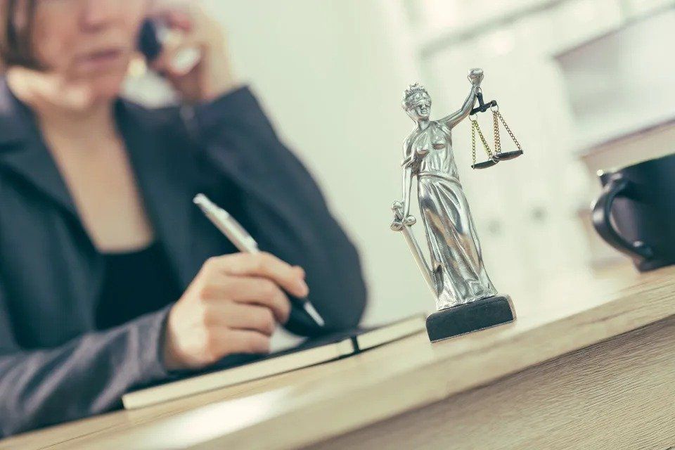 Lawyer Talking to Someone on Phone — Eau Claire, WI — Cohen Law Offices