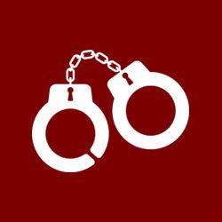 A pair of handcuffs with chains attached to them on a red background.