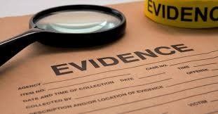 Magnifying Glass and Evidence — Eau Claire, WI — Cohen Law Offices Magnifying Glass and Evidence — Eau Claire, WI — Cohen Law Offices