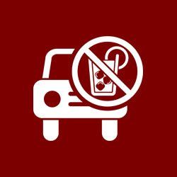 A car with a sign that says no drinking in the car.