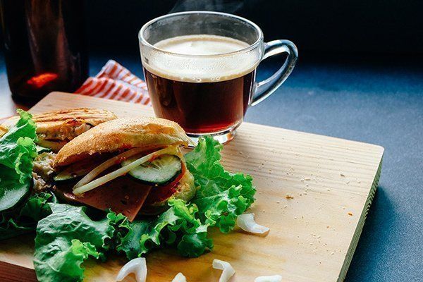 Fresh sandwich with greens and coffee cup – breakfast in Mykonos Beauty Cafe cafe
