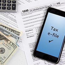 Mobile Phone & Dollar Bill - E-Filing in Coon Rapids, MN