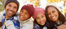 Smiling family of four