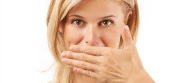 Woman covering mouth with hand