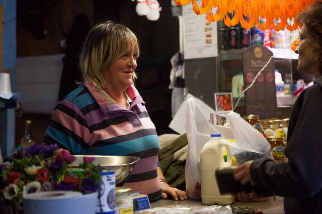 Juliette serves one of her regular costumers at her stall in Perran-ar-worthal, Cornwall. 30.10.15 Juliette serves one of her regular costumers at her stall in Perran-ar-worthal, Cornwall. 30.10.15