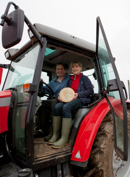 Julie and Trevor Howe in their tractor with one of their cheeses, at their farm in Ponsanooth, Cornwall. 19.10.15 Julie and Trevor Howe in their tractor with one of their cheeses, at their farm in Ponsanooth, Cornwall. 19.10.15
