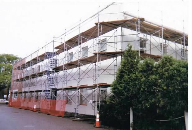 Building Before Surrounded with Scaffolding