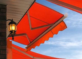 Quality Awning — Orange Colored Awning in Palm Beach, FL Quality Awning — Orange Colored Awning in Palm Beach, FL