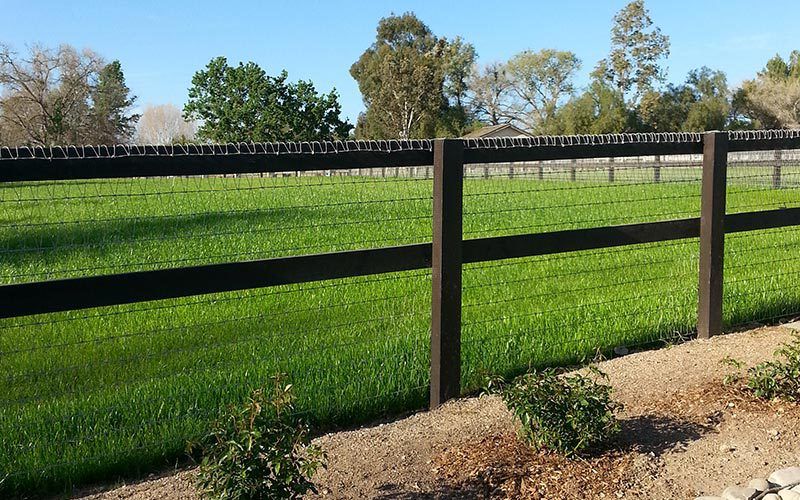 Image of fenching with wood posts and wire fencing