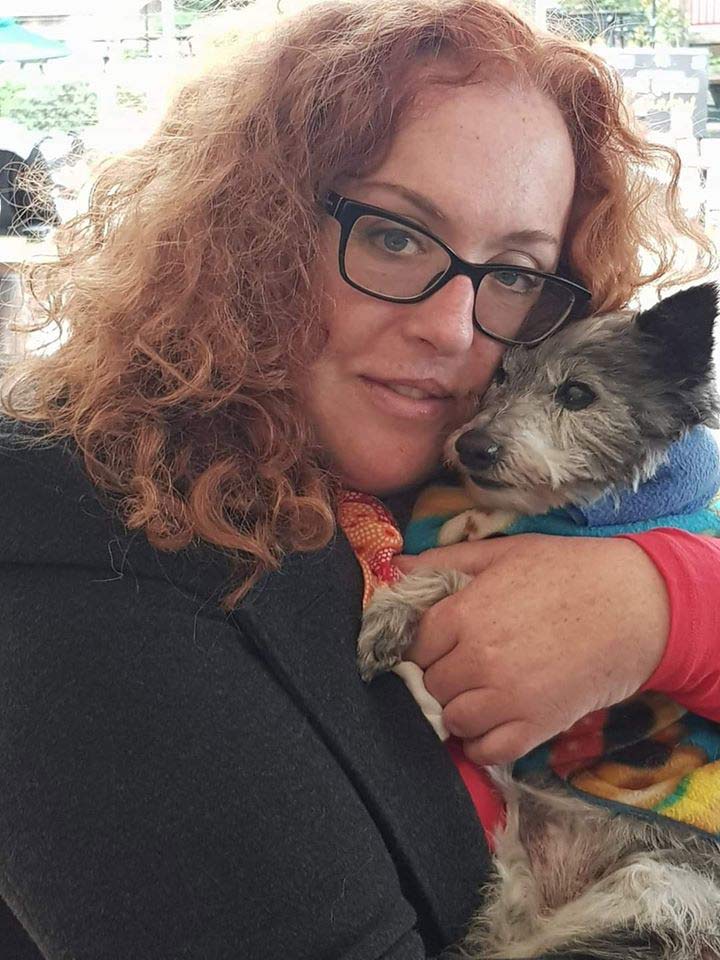 woman hugging her dog