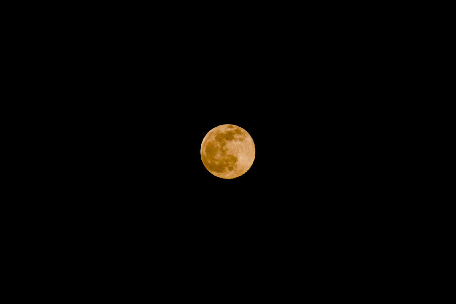 Our moon aglow. 