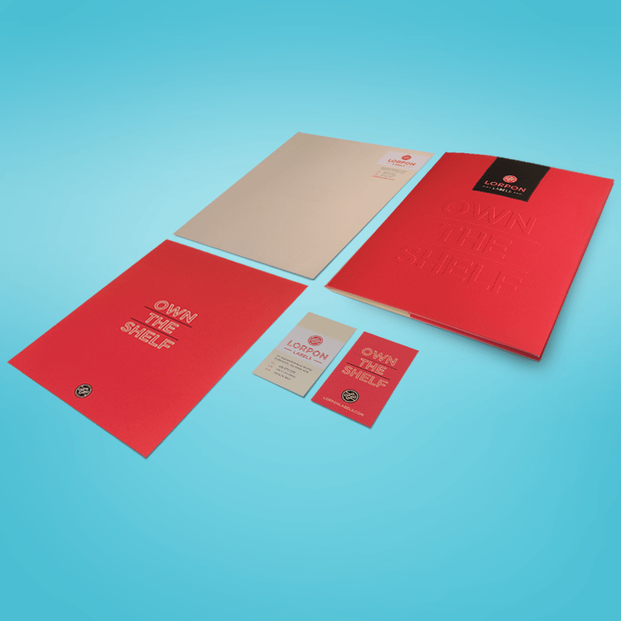 A red folder with the words own the shelf on it