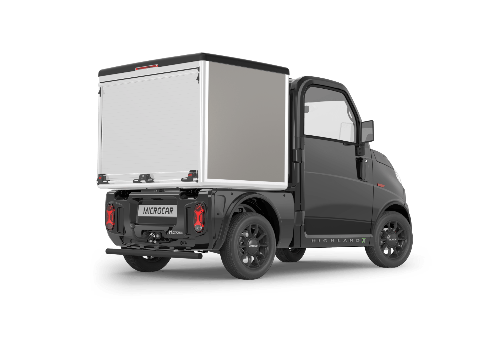 Un petit camion noir avec une boîte blanche à l'arrière.