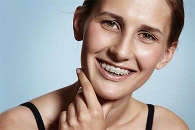 Adult Woman Wearing Braces — Orthodontics in Reading, MA Adult Woman Wearing Braces — Orthodontics in Reading, MA