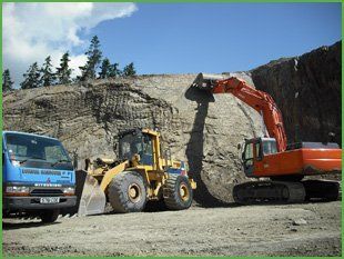  Diggers at work on a quarry
