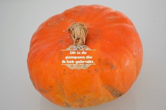 Orange pumpkin with text overlay: