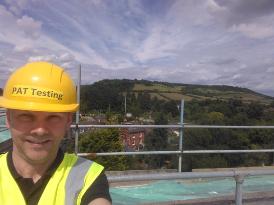 man PAT Testing on building site