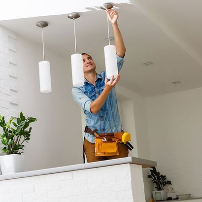 Installing A Lamp To A Ceiling — Salt Lake City, UT — Ace Electrical, Inc. Installing A Lamp To A Ceiling — Salt Lake City, UT — Ace Electrical, Inc.
