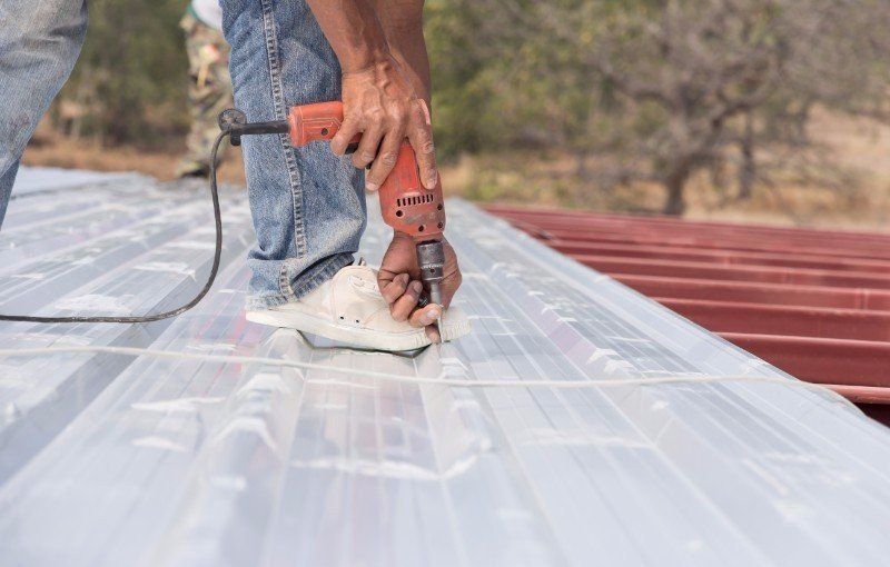 Man working on roof Metal cheese in site construction
