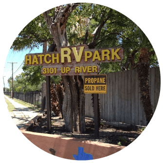 A sign that says hatch rv park on it