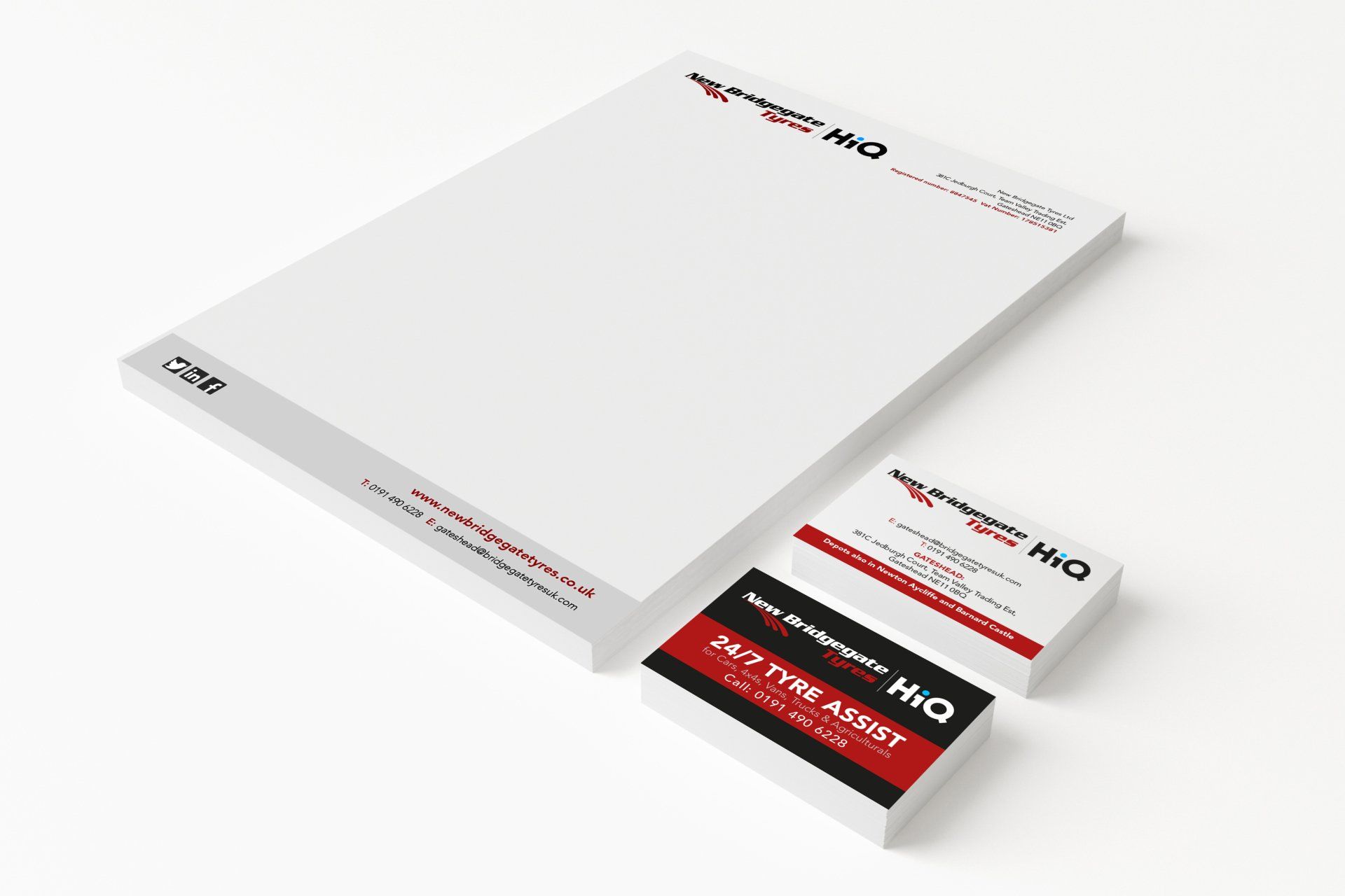 A letterhead and business card are stacked on top of each other