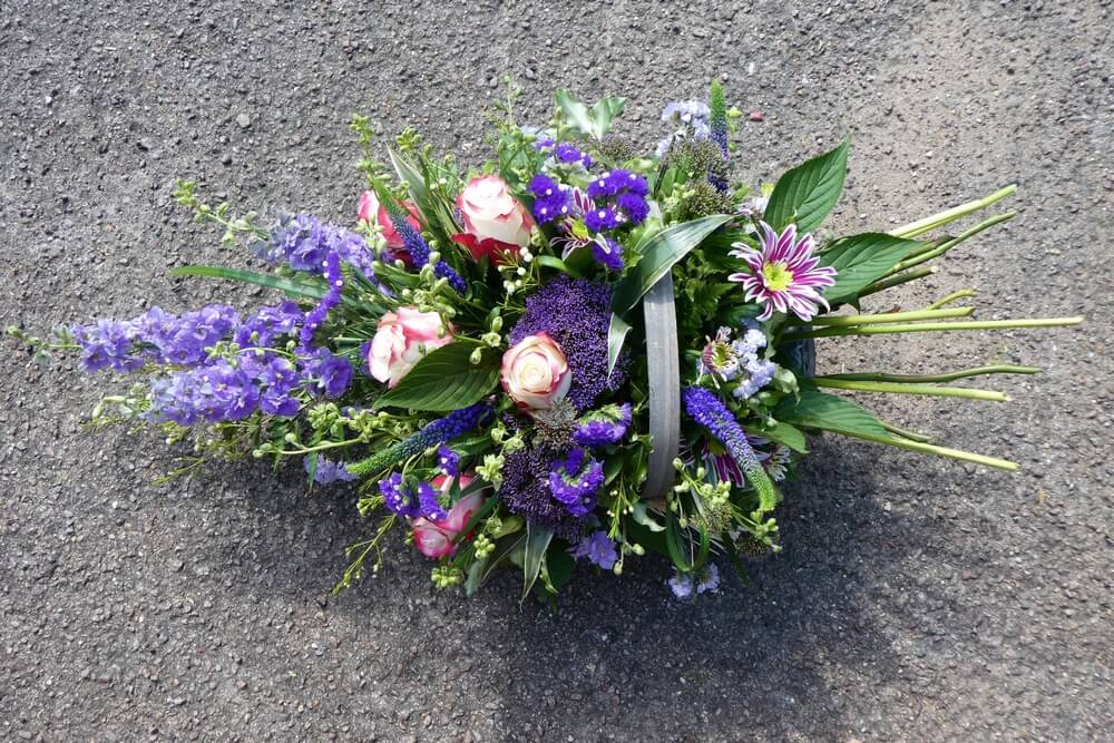 6.  Trug Basket of purple Larkspur, Trachelium, Veronicas, Statice and two tone Roses